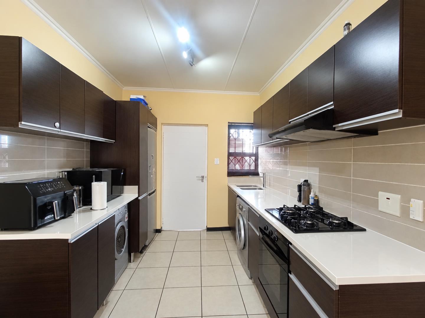 769571_Tidy_Modern_Galley_Kitchen.png